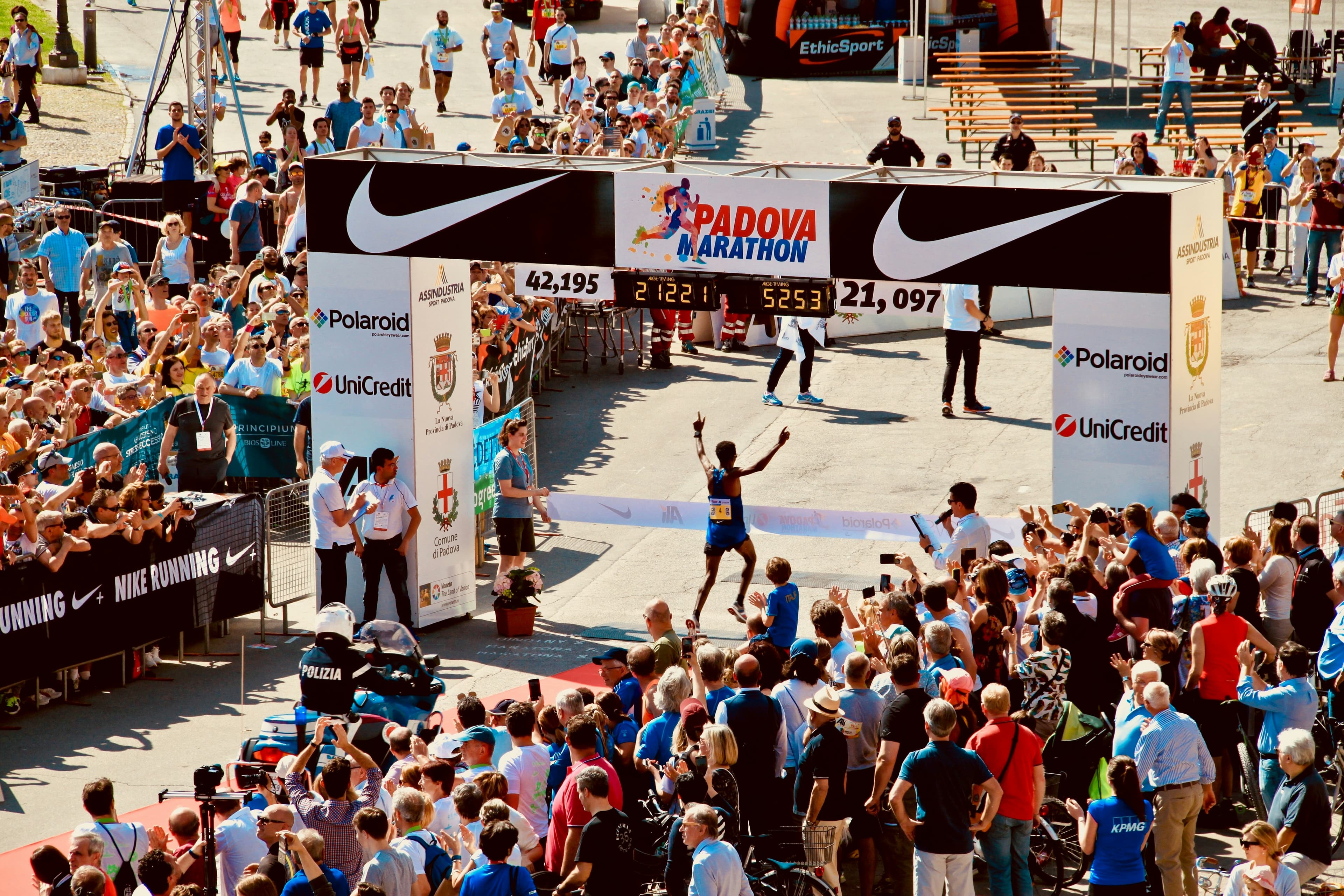 A crowd of runners at a finish line